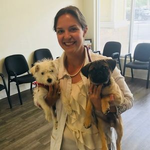 Dr. Fisher holding dogs